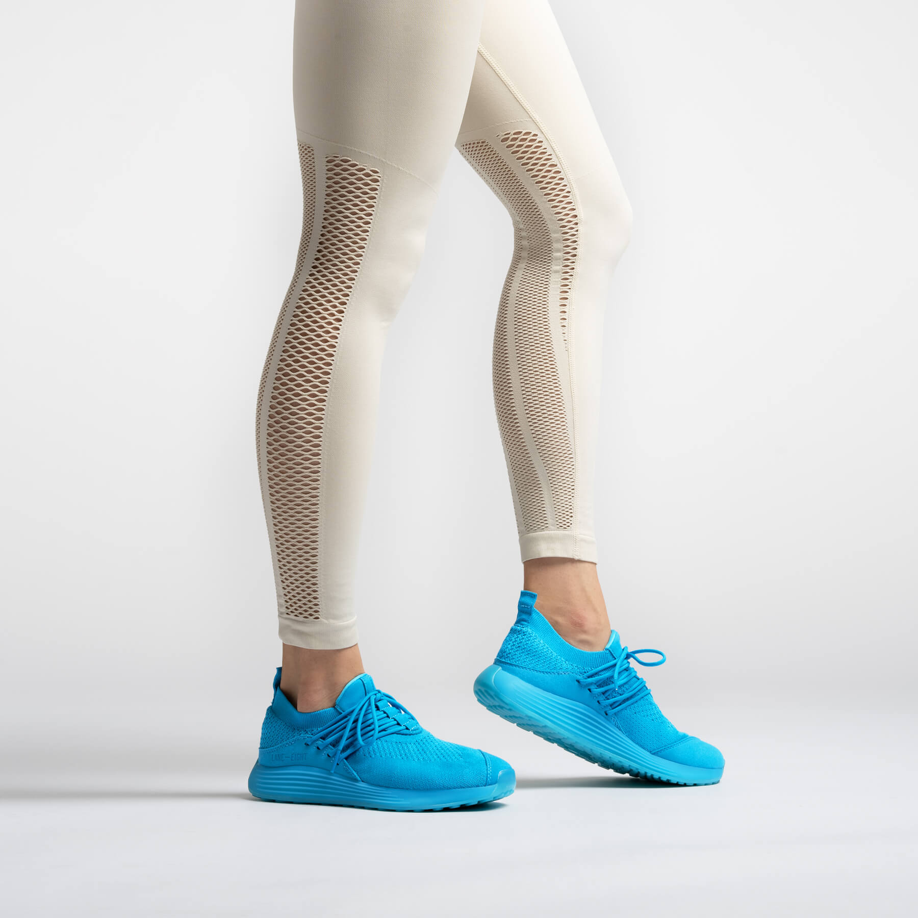 LANEEIGHT-TRAINER-AD-1-ElectricBlue-WomensOnFoot.jpg